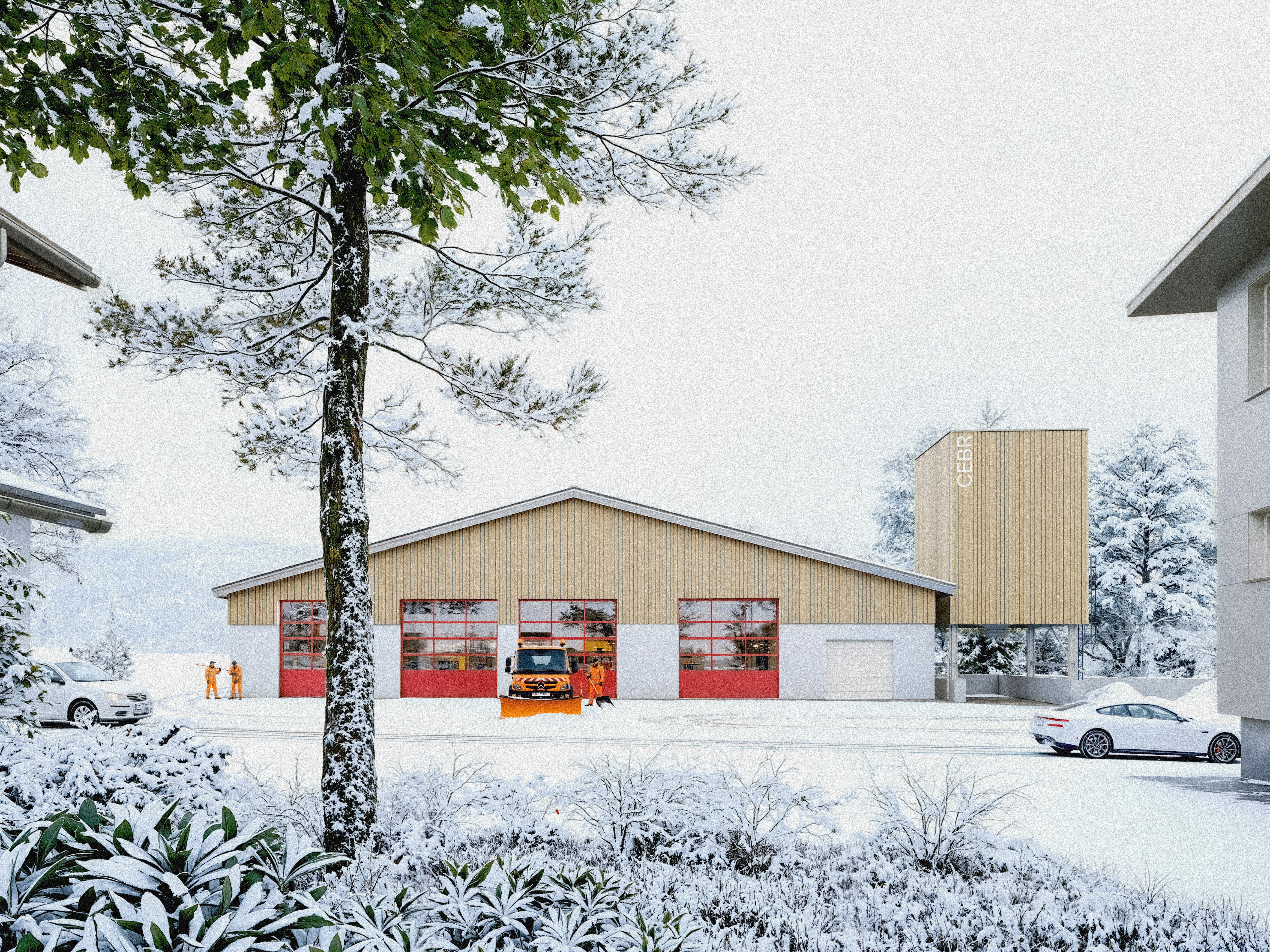 Vue de la façade principale du centre d'entretien routier de La Brévine dans un paysage enneigé. Les équipes préparent les opérations de déneigement devant le bâtiment revêtu d'un bardage en bois.